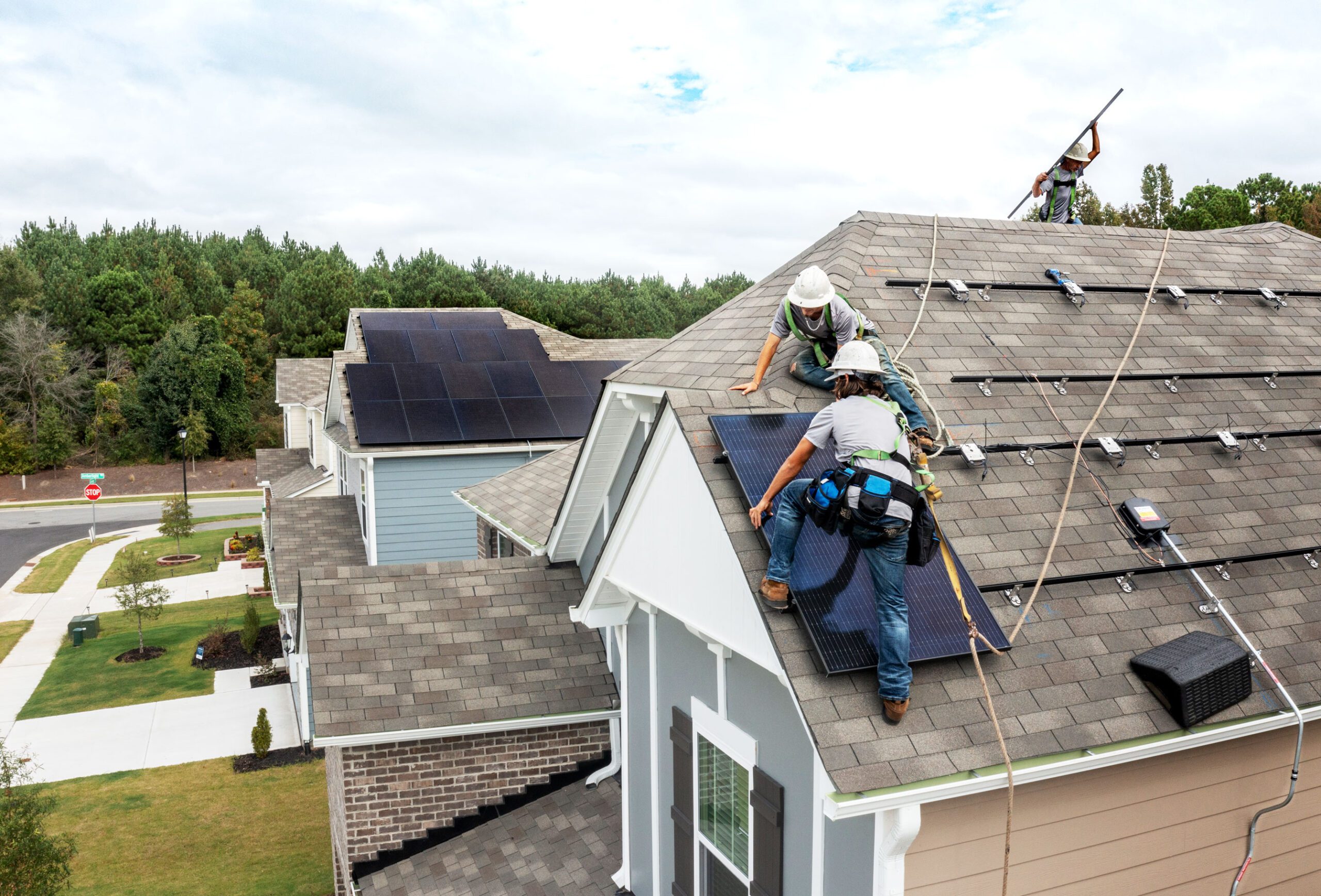 Nexus crew installing solar panels on residential roof