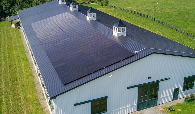 Solar installation on horse barn with cupolas