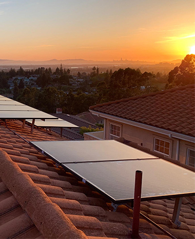 Tile roof solar installation at sunset